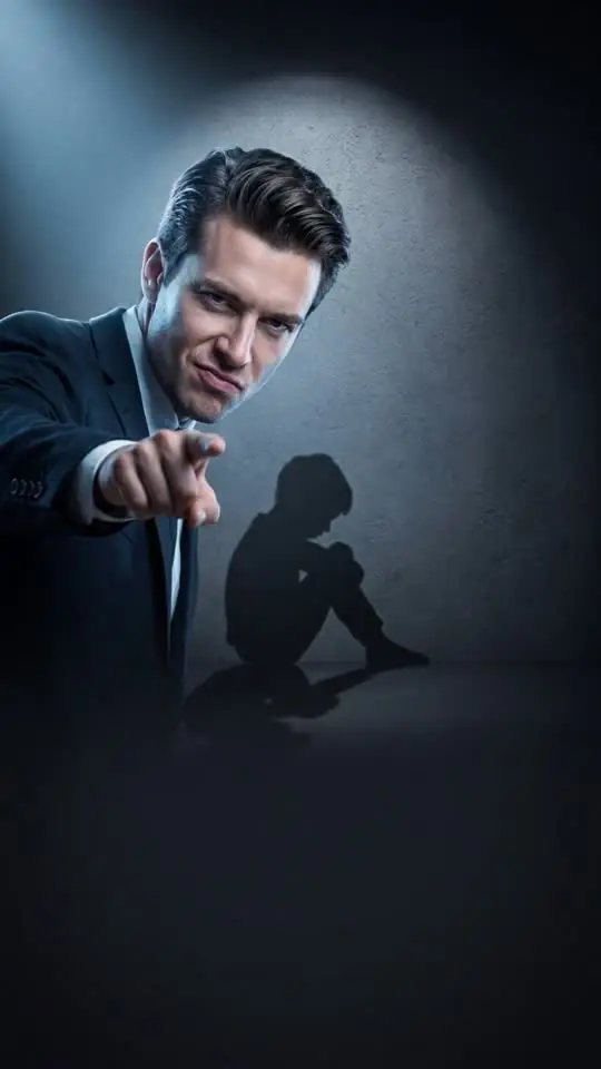 A smirking man in a suit points at you. His shadow on the wall is a small child hugging their knees. (AI-generated image)